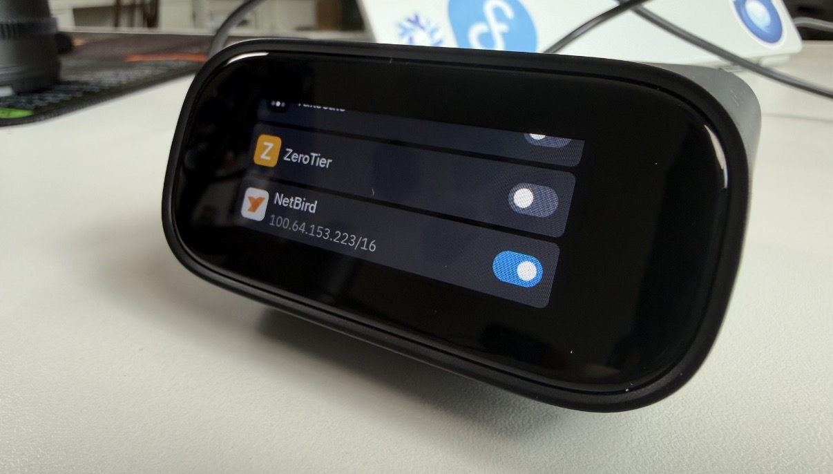 NetBird on the Comet Pro touchscreen VPN settings, showing the assigned overlay IP